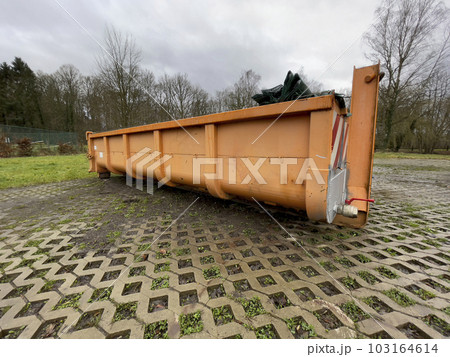 Yard waste dumpster. Construction dumpster for bulky household waste or loaded dumpster Yard waste dumpster. Construction dumpster for bulky household waste or loaded dumpster 103164614