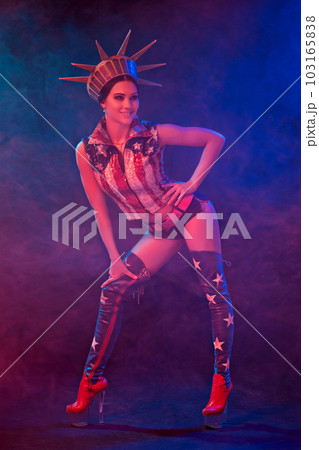 Young woman in stage costume of striptease dancer posing 103165838