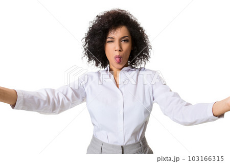 Young beautiful African American woman makes self against the white background in studio 103166315