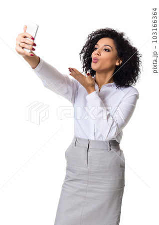 Beautiful brunette woman in classic white shirt and skirt make selfie on the phone. Beautiful brunette woman in classic white shirt and skirt make selfie on the phone. 103166364