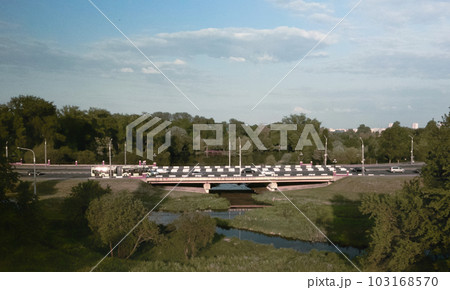 City highway. Overpass across the river. On the horizon at home. Aerial photography. 103168570