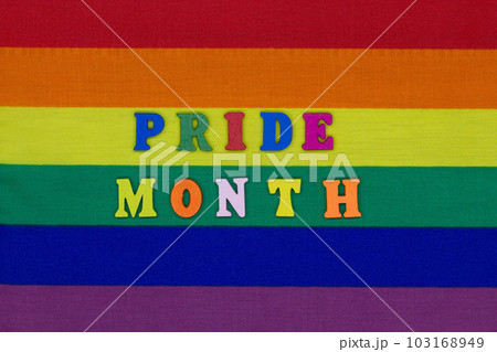 Pride Month letters on the LGBT flag background. Rainbow flag is a symbol of the rights of homosexual, gay, lesbian and transgender people. Concept Expression and diversity of the LGBTQI community 103168949