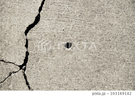 Texture of an old stone with a crack. Grunge brick texture. Texture of an old stone with a crack. Grunge brick texture. 103169182