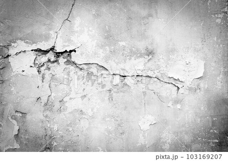 Old wall with deep cracks. Grunge gray color texture. Destruction on the surface of the wall. 103169207