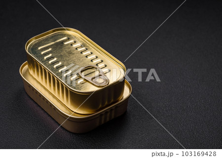 Tin or aluminum rectangular can of canned food with a key 103169428