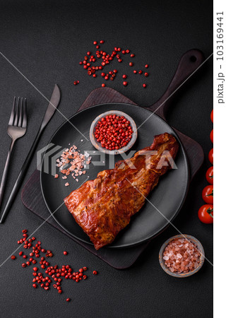 Delicious grilled or smoked pork ribs with salt, spices and herbs 103169441