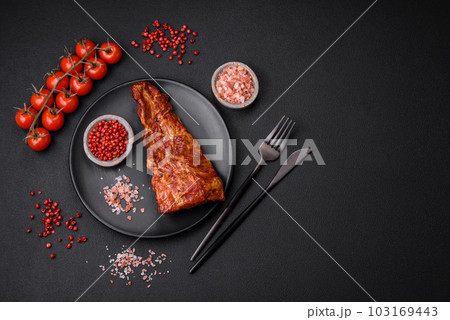 Delicious grilled or smoked pork ribs with salt, spices and herbs Delicious grilled or smoked pork ribs with salt, spices and herbs 103169443