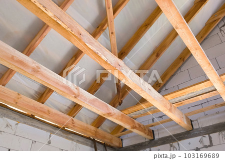 Wooden frame of the new roof. Roof structures. Wooden structures Wooden frame of the new roof. Roof structures. Wooden structures 103169689