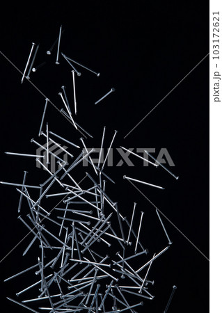 Long Nail fly floating in mid air. Many group screw nails short long metal fall as construction tools. Black background isolated. New Screwdriver Nail fall down unbox steel hardware work Long Nail fly floating in mid air. Many group screw nails short long metal fall as construction tools. Black background isolated. New Screwdriver Nail fall down unbox steel hardware work 103172621
