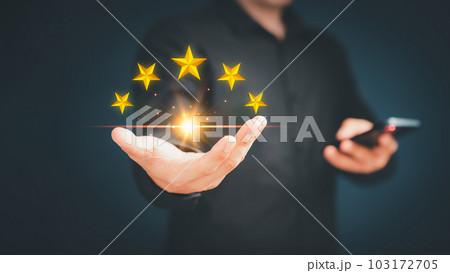 Customer or client man hand showing the stars icon to complete five stars. Assessment customer service giving the five star rating, service feedback, satisfaction and testimonial concept. 103172705