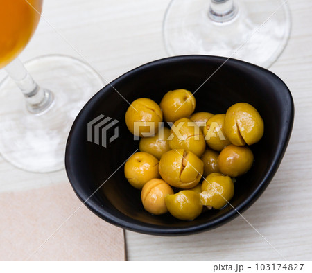 Pickled olives with a stone - a typical Spanish tapas. 103174827