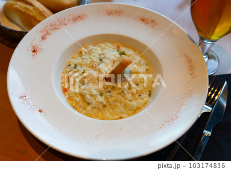 Chicken and vegetable risotto with 4 cheeses and Parmesan 103174836