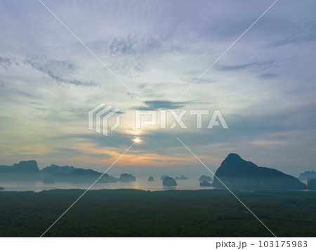 aerial view Amazing light of nature cloudscape sky above Samed Nang Chee Phang Nga archipelago. .Imagine a fantasy bright red sky at sunrise from a bird's eye view..tropical landscape background. 103175983