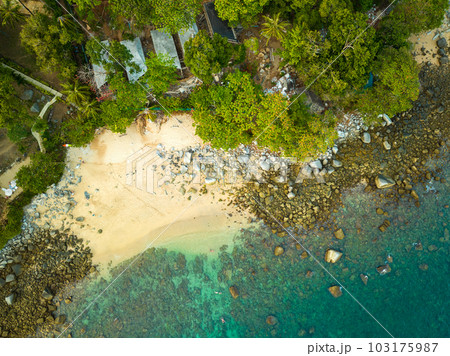 aerial top view Ao Sean small white sand beach lined with rocks. turquoise sea at Ao Sane beach Phuket.  colorful blue sea background. beautiful nature in the hidden beach. 103175987