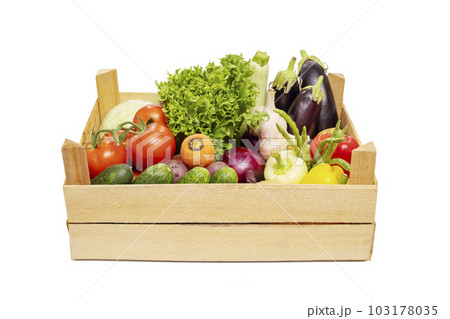 Fresh vegetables in a wooden box isolated on a white background. Eco lifestyle 103178035