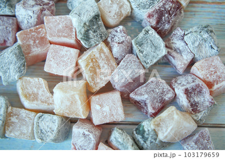 turkish delight or lokum of red, green, orange and yellow colors. turkish delight or lokum of red, green, orange and yellow colors. 103179659