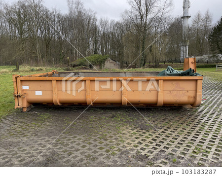 Yard waste dumpster. Construction dumpster for bulky household waste or loaded dumpster 103183287