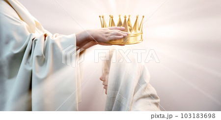 Hands placing a crown on a woman's head 103183698