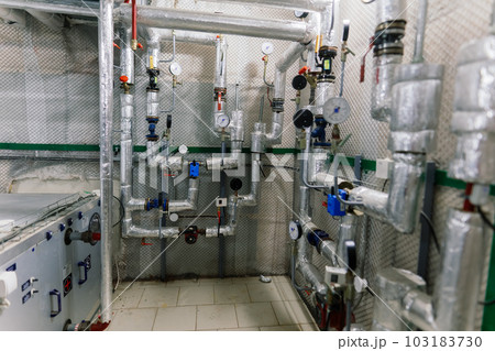 Pressure sensor in an industrial boiler room. Barometer in the heating system. Close-up. 103183730