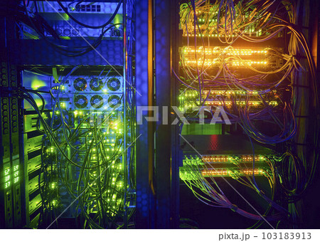 Illuminated servers and computer cables in server room Illuminated servers and computer cables in server room 103183913