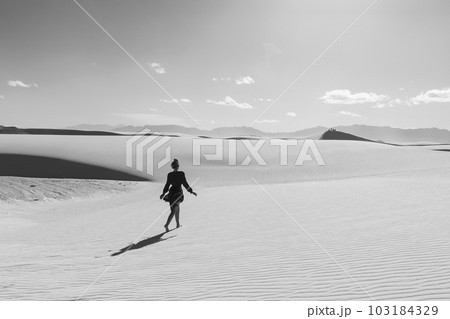 United States, New Mexico, White Sands National Park, Teenage girl walking United States, New Mexico, White Sands National Park, Teenage girl walking 103184329