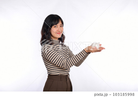 Portrait of young Asian woman casual uniform holding white piggy bank isolated on white background, Financial and bank saving money concept 103185998