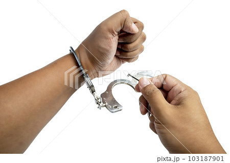 Arrested man with a handcuff on his hand 103187901