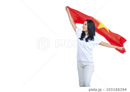 Asian women celebrate Vietnam independence day on 02 September by holding the Vietnam flag 103188394