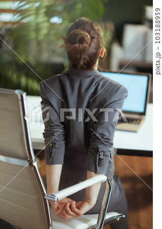 modern business woman in modern green office stretching hand 103188959