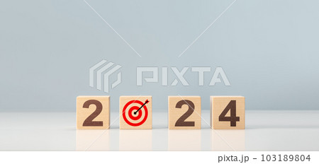 2024 goal, plan, action. 2024 happy new year concept, wooden cube block with target goal and 2024. Business management, Inspiration to success ideas and goals. 103189804