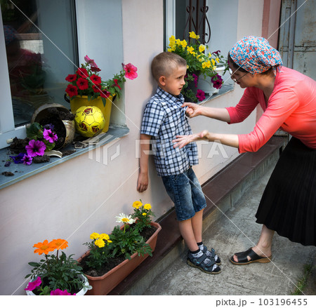 Mom scolds son for broken flowerpot Mom scolds son for broken flowerpot 103196455