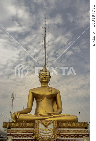 The Sacred Buddha is named "Phra Buddhachinnasi" in Wat Khiriwong Temple, which has the blue sky background. The temple is located on the top of the Hill and It is worshiped by people of Pak Nam Pho. The Sacred Buddha is named "Phra Buddhachinnasi" in Wat Khiriwong Temple, which has the blue sky background. The temple is located on the top of the Hill and It is worshiped by people of Pak Nam Pho. 103197751