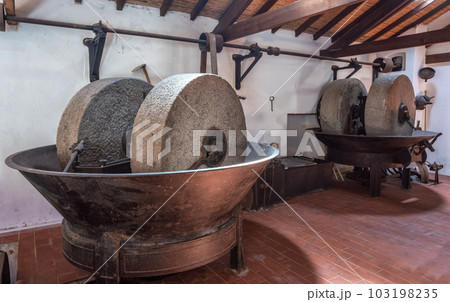 Olive oil press is installed in premises of the ancient equipment for production of olive oil, stone mill and mechanical press, olive oil mill. Olive oil press is installed in premises of the ancient equipment for production of olive oil, stone mill and mechanical press, olive oil mill. 103198235
