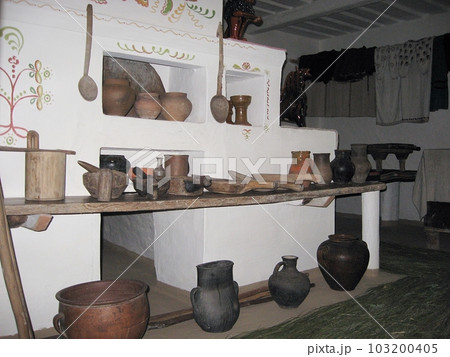 Interior and antique household utensils inside a historic Ukrainian dwelling. Interior and antique household utensils inside a historic Ukrainian dwelling. 103200405