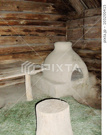 An example of an old utility room from the Middle Ages in an open-air museum in the Ukrainian city of Pereyaslav-Khmelnitsky. The interior of a medieval utility room. 103200415