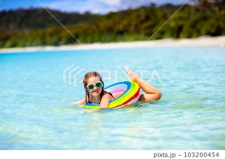 Child on tropical beach. Sea vacation with kids. 103200454