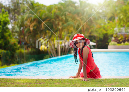 Child in swimming pool on ring toy. Kids swim. Child in swimming pool on ring toy. Kids swim. 103200643