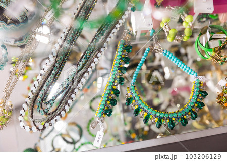 Fashionable handmade bracelets on the showcase of jewelry store Fashionable handmade bracelets on the showcase of jewelry store 103206129