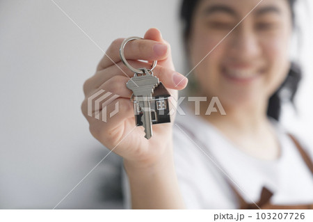 Woman owner buy purchase home, relocate to dwelling, rental, rent, ownership concept Woman owner buy purchase home, relocate to dwelling, rental, rent, ownership concept 103207726