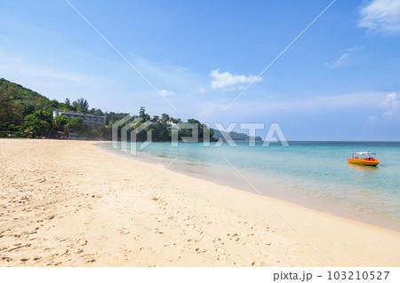 Beautiful Surin beach in Choeng Thale city, Phuket, Thailand with white sand, turquoise water and palm trees Beautiful Surin beach in Choeng Thale city, Phuket, Thailand with white sand, turquoise water and palm trees 103210527