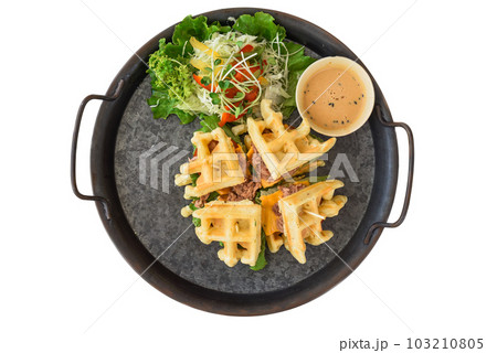 Belgium waffles with tuna on plate isolated on white background 103210805