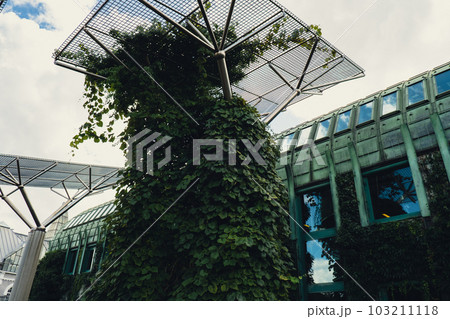 Botanical garden on the roof of the Warsaw University library modern architecture and greenery. Sustainable building architecture futuristic biophilia design. Ecological green modern building. Modern 103211118