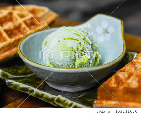 Homemade ice cream with chocolate syrup and marmalade on wooden background 103211630