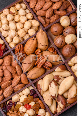 Mix of roasted macadamia nuts, cashews, pecans, almonds, raisins and dry berries 103212945
