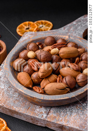 Mix of roasted macadamia nuts, cashews, pecans, almonds, raisins and dry berries 103212977