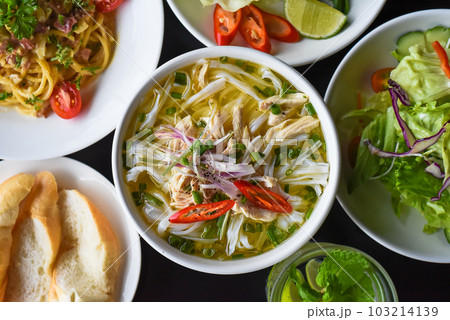 Lunch set made of chicken soup, salad,pasta carbonara, lemonade on black background 103214139