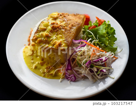 Grilled basa fish with rice and salad on black background 103217547