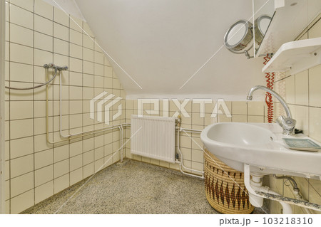 a bathroom that is very clean and ready to use as a shower stall or room for the public toilet area 103218310