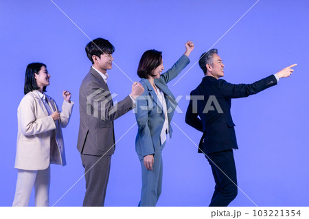Asian Korean senior, middle aged and young male and female colleagues models in business attire, neon purple studio background, walking in the same direction Asian Korean senior, middle aged and young male and female colleagues models in business attire, neon purple studio background, walking in the same direction 103221354