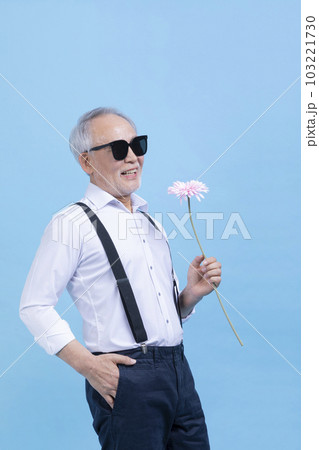 happy active young senior Korean Asian male holding flowers happy active young senior Korean Asian male holding flowers 103221730